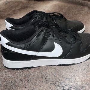 Black and white men’s Nike Dunks